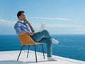 Relaxed young man at home on balcony Royalty Free Stock Photo