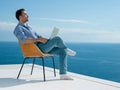 Relaxed young man at home on balcony Royalty Free Stock Photo