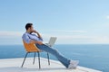 Relaxed young man at home on balcony Royalty Free Stock Photo