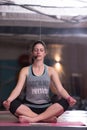 Sportswoman doing yoga exercise and meditating Royalty Free Stock Photo