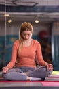 Sportswoman doing yoga exercise and meditating Royalty Free Stock Photo