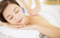 Relaxed Young woman enjoy massage in spa salon Royalty Free Stock Photo