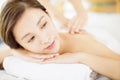 Relaxed Young woman enjoy massage in spa salon Royalty Free Stock Photo