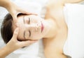 Relaxed Young woman enjoy massage in spa salon Royalty Free Stock Photo