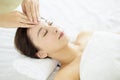 Relaxed Young woman enjoy massage in spa salon Royalty Free Stock Photo