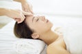 Relaxed Young woman enjoy massage in spa salon Royalty Free Stock Photo