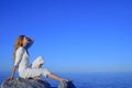 Relaxed young woman enjoying sunset by the sea Royalty Free Stock Photo