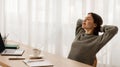 Relaxed young woman entrepreneur resting at home office Royalty Free Stock Photo