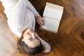 Relaxed young woman lying on the floor Royalty Free Stock Photo