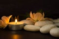 Relaxing atmosphere with candlelight, hot stones and incense. Spa, Wellness and Beauty concept Royalty Free Stock Photo