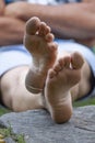 Relaxing barefoot man sitting and relaxing Royalty Free Stock Photo