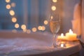 Relaxing Bath Scene with Champagne, Candlelight, and Cozy Ambiance. Royalty Free Stock Photo