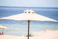 Relaxing Beach background with umbrellas and sea Royalty Free Stock Photo