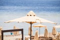 Relaxing Beach background with umbrellas and sea Royalty Free Stock Photo