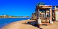 Relaxing at beach at white beach - travel destination for vacation - Hurghada, Red Sea, Egypt Royalty Free Stock Photo