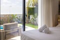 Relaxing bedroom retreat with garden and pool view Royalty Free Stock Photo