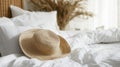 Relaxing Bedroom Scene With Straw Hat On Bed Linen Royalty Free Stock Photo