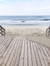 Relaxing and Calm Baltic Landscape Light Sandy beach,Cold Sea and wooden path. Royalty Free Stock Photo