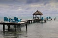 Relaxing Caribbean view from bright blue wooden loungers.