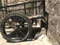 Relaxing cat on the streets of Kotor Montenegro. Cat laying in the shadow of bike.