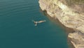 Aerial view of a woman in a swimsuit lying on her back in the blue Lake. Beautiful girl is relaxing in the blue Lake Royalty Free Stock Photo