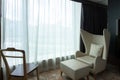 Relaxing corner armchair in hotel accommodation bedroom