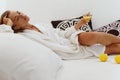 Relaxing european girl drink lemonade on bed