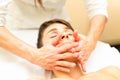 A relaxing facial massage performed by a professional Royalty Free Stock Photo