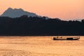 Relaxing on ferryboat on the Mekong River at dusk
