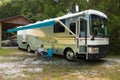 Relaxing in front of a class a motorhome