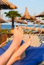 Relaxing in a hammock on a sunny beach Royalty Free Stock Photo