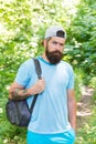 Relaxing hiking Experience. Bearded man carry backpack. ready for camping. male tourist wear cap. sport and fitness