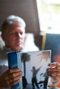 Relaxing with his favourite magazine. a senior man reading a magazine in his bedroom.