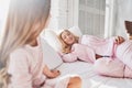 Relaxing at home. Mother and daughter spending carefree morning