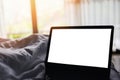 Relaxing in the hotel room and working labtop on the bed and nature sunrise window view bedroom - blank screen labtop Royalty Free Stock Photo