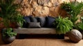 Relaxing indoor garden with a stone wall and comfortable cushions. Royalty Free Stock Photo