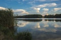 relaxing lake at sunset  Colorful sunset observed over lake on calm summer evening. Reflection of sky on lake made a dramatic Royalty Free Stock Photo