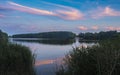 relaxing lake at sunset  Colorful sunset observed over lake on calm summer evening. Reflection of sky on lake made a dramatic Royalty Free Stock Photo