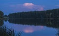 relaxing lake at sunset  Colorful sunset observed over lake on calm summer evening. Reflection of sky on lake made a dramatic Royalty Free Stock Photo