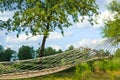 Relaxing lazy time with hammock in the green forest. Beautiful landscape with swinging hammock in the summer garden, sunny day Royalty Free Stock Photo