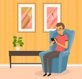 Man sits in cozy armchair with smartphone. Person browsing social media on mobile phone at home