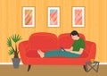 Relaxing man sits on sofa with smartphone. Person browsing social media, surfing internet with phone