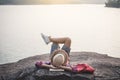 Relaxing moment Asian boy backpacker in nature