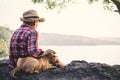 Relaxing moment Asian boy and dog in nature