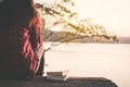 Relaxing moment Asian tourist reading a book on park