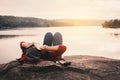 Relaxing moment Asian tourist reading a book on rock Royalty Free Stock Photo