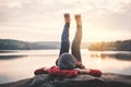 Relaxing moment Asian tourist sleeping on rock waiting for sunset