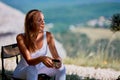 Relaxing moment. Contemplation. Time to relax. Woman sitting on chair, drinking coffee and looking away thoughtfully Royalty Free Stock Photo