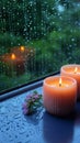 Relaxing moments aroma candles flame glows near a rain drenched window Royalty Free Stock Photo