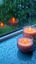 Relaxing moments aroma candles flame glows near a rain drenched window Royalty Free Stock Photo